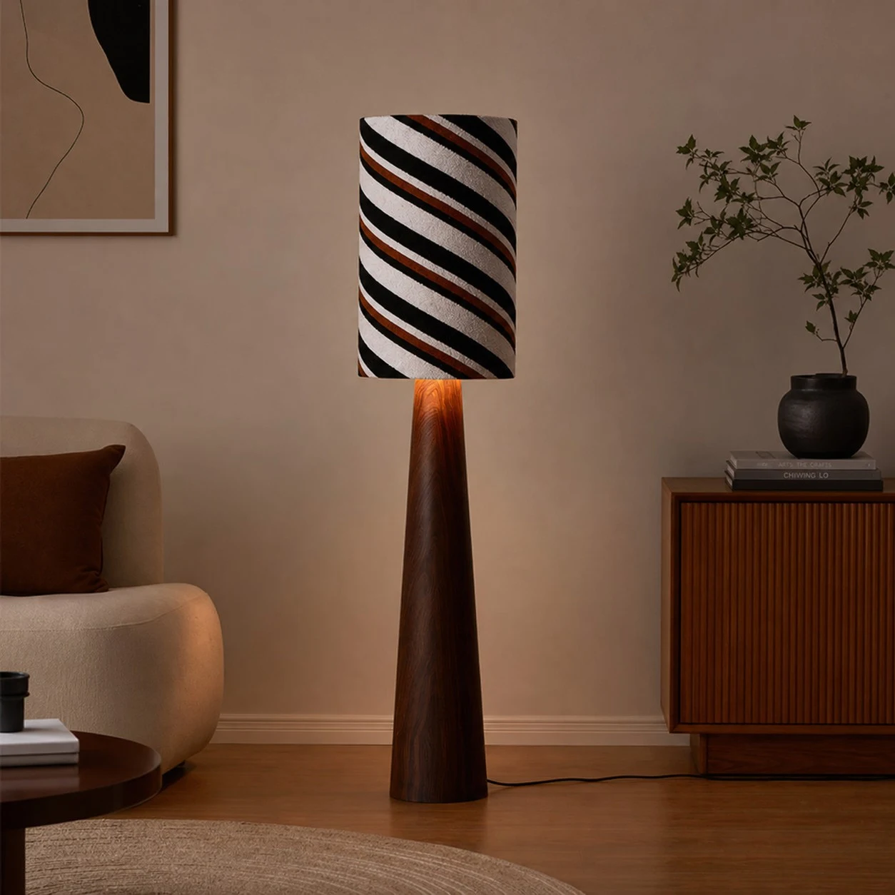 Striped fabric floor lamp styled beside a sideboard in a warm living room