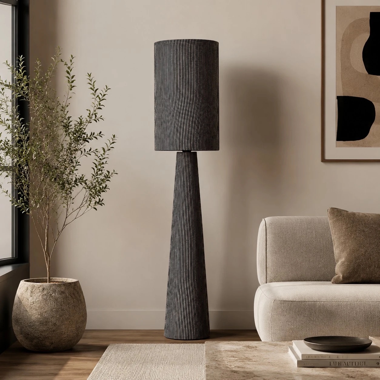 Gray striped floor lamp beside a cream sofa in a living room