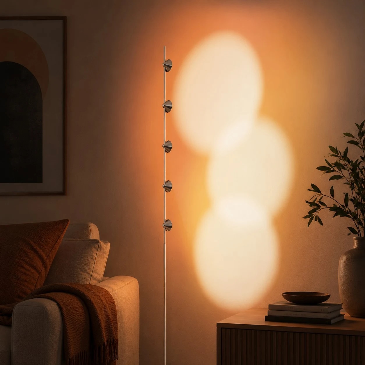 Sunset projection floor lamp glowing beside a lounge chair