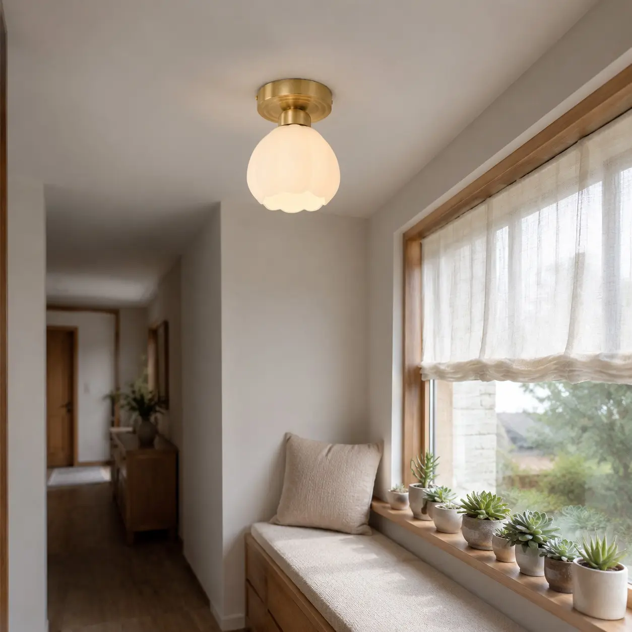 Milk glass flower ceiling light above a window seat